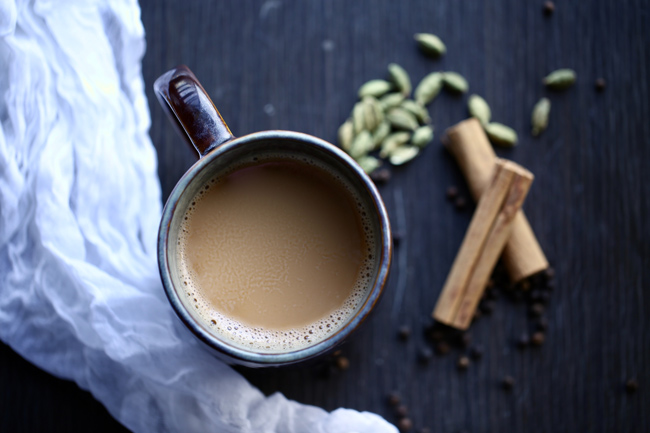 Lotus Cuisine of India - Chai for the Holidays - Cup of Chai tea with spices and cloth 